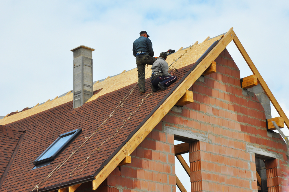 contractors fixing a roof